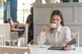 Woman with reading and drink coffee