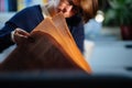 Woman reading in the evening room latest newspaper