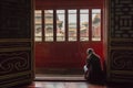 Woman reading at Forbiden city, Beijing Royalty Free Stock Photo