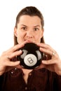 Woman reading the future from a toy eightball Royalty Free Stock Photo
