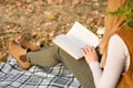 Autumn Bliss: A Serene Moment of Reading Amidst Nature Royalty Free Stock Photo