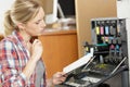 woman reading instruction manual for photocopier Royalty Free Stock Photo