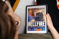 Woman reading on iPad Pro about Notre-Dame de Paris fire