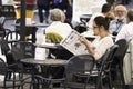 Woman reading an Italian newspaper