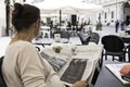 Woman reading an Italian newspaper