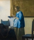 Woman reading a letter, painting by Johannes Vermeer Royalty Free Stock Photo