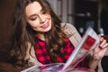 Woman reading magazine at home Royalty Free Stock Photo