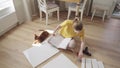 Woman reading manuals to assembling furniture