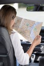 woman reading map in car Royalty Free Stock Photo