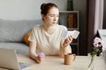 Woman Reading Menstrual Cup Instructions Royalty Free Stock Photo