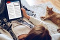 Woman reading news on tablet Royalty Free Stock Photo