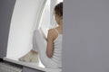 Woman Reading Novel On Window Sill