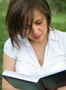 Woman reading outdoors Royalty Free Stock Photo