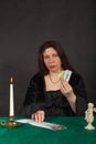 A woman is reading tarot cards