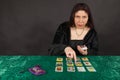 A woman is reading tarot cards