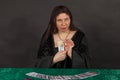 A woman is reading tarot cards