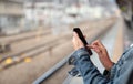 Woman is reading text message on mobile phone Royalty Free Stock Photo