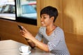 Woman reading text message on mobile phone