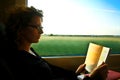 Woman reading in the train Royalty Free Stock Photo