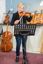 Woman reading violin notes