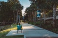 Woman reads on bench at Cranes Roost park