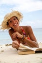 Woman reads a book on beach Royalty Free Stock Photo