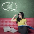 Woman reads books while dreaming a house Royalty Free Stock Photo