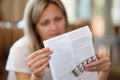 Woman reads medical instruction at home. Royalty Free Stock Photo