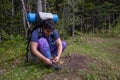 Hiker ties up boots Royalty Free Stock Photo