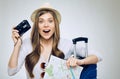 Woman ready to holiday with camera, paper map