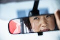 Woman in rearview mirror