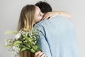 Woman receive a bouquet of flower from her lover