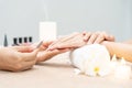 Woman receive care service by professional Beautician Manicure at spa centre. Nail beauty salon use nail file for Glazing