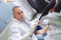 woman receives foot examination from gloved podiatrist