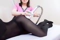 Woman receives LPG massage to remove cellulite from her body, for lifting legs. Concept beauty therapy in spa salon Royalty Free Stock Photo