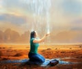 Woman receives rain from heaven Royalty Free Stock Photo