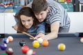 woman receiving advice on shooting pool ball while playing billiards Royalty Free Stock Photo