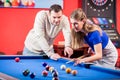 Woman receiving advice on shooting pool ball while playing billiards Royalty Free Stock Photo