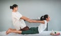 Woman receiving Back Massage Stretching in Thai Therapy Spa treament Royalty Free Stock Photo