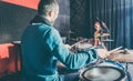 Woman receiving drum lessons from her music teacher