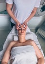 Woman receiving facial treatment on clinical center Royalty Free Stock Photo