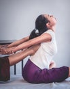 Woman receiving feet push on her back for Thai massage stretching in a Thai traditional spa Royalty Free Stock Photo