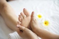 Woman receiving foot massage service from masseuse close up at hand and foot Royalty Free Stock Photo