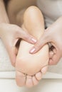 Woman receiving foot massage in spa salon Royalty Free Stock Photo