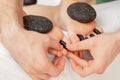 Woman receiving hot stone massage. Royalty Free Stock Photo