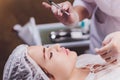 Woman receiving a injection in her lips, close up. Royalty Free Stock Photo