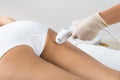 Woman receiving laser treatment on buttock