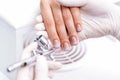 Woman receiving manicure by airbrush Royalty Free Stock Photo