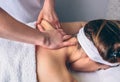 Woman receiving massage on shoulders in clinical center Royalty Free Stock Photo