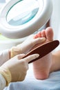 Woman receiving podiatry treatment in Day Spa